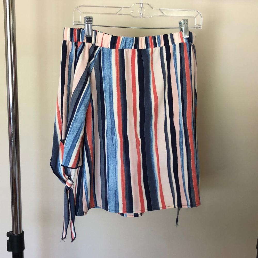 Woman’s off the shoulder top.